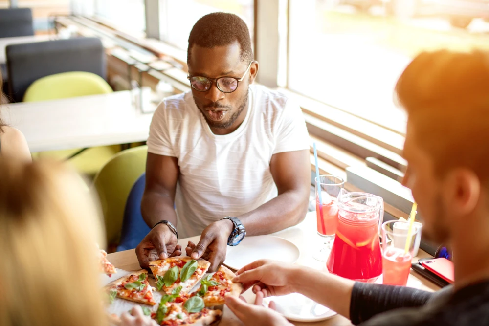 People having pizza